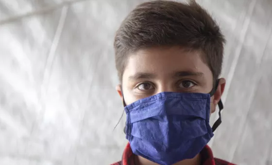 A boy wearing a mask during the pandemic.