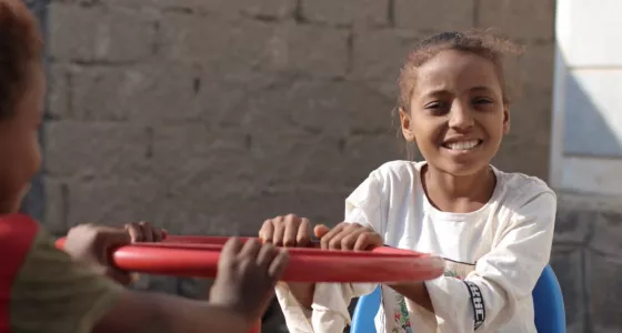 Aisha playing in a War Child child friendly space in Yemen. 