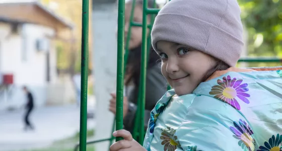 Girl playing in a playground in Moldova