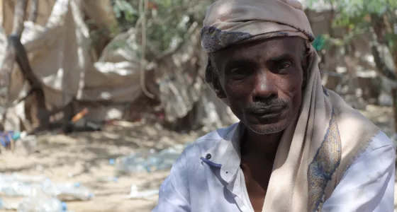 Noor Hassan, 45 years old, poses for a photograph in a camp in Yemen