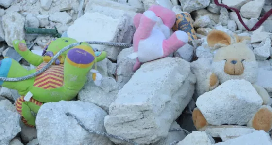 Childrens toys in the rubble from a destroyed building in Syria. 