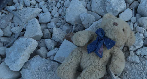 A childs teddy bear in the rubble of a colapsed building, Syria. 