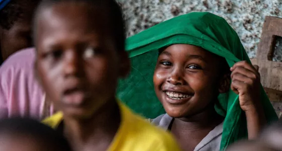 A young girl smiling in Central African Republic. 