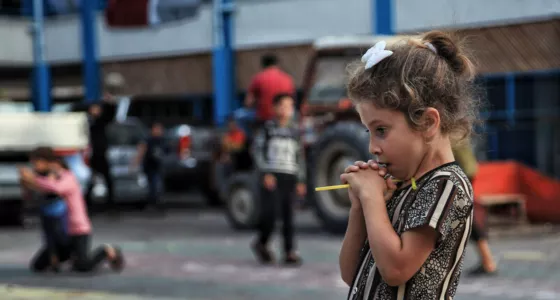 Girl standing in a playground in Gaza. 