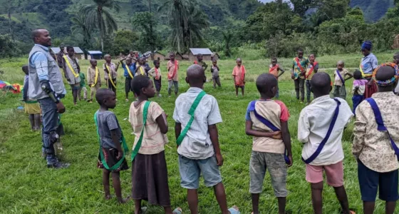 Children standing in a circle in DRC playing