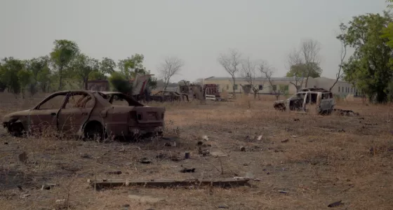 Two destroyed cars in South Sudan.
