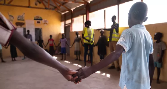 People holding hands.