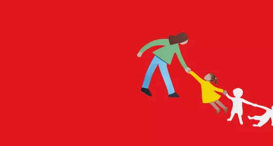 An adult holding a childs hand on a red background