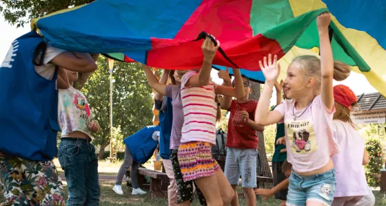 Children playing with a parachute in Ukraine.