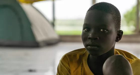 Sudanese boy looks into camera