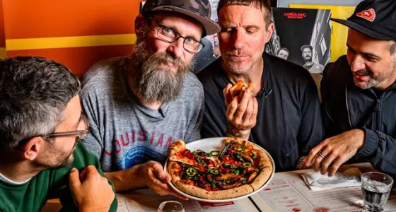 Sleaford Mods eating pizza