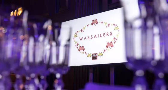 dinner glasses with wassailers table holder in the background