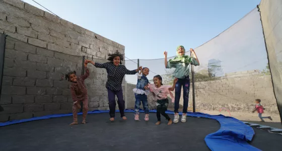 5 children jumping on trampoline