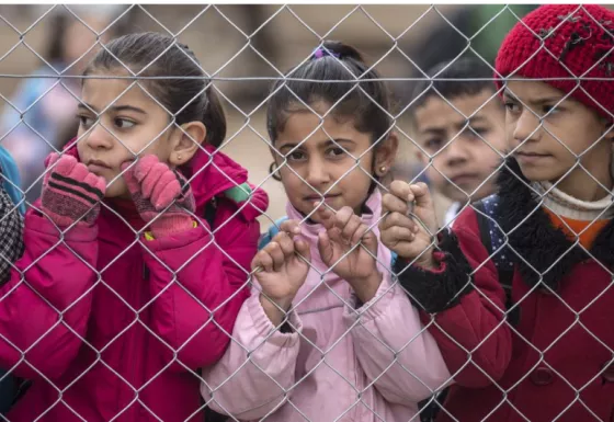 Children wait for school to begin in a refugee camp in northern Iraq. Credit: Richard Pohle 
