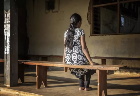 A girl sat outside a War Child Holland programme in Sri Lanka. Credit Jeppe Schilder/War Child Holland 