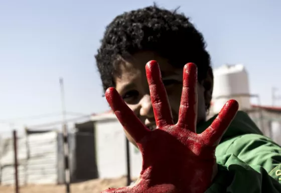 The red hand symbolises the fight against the use of children in war. 