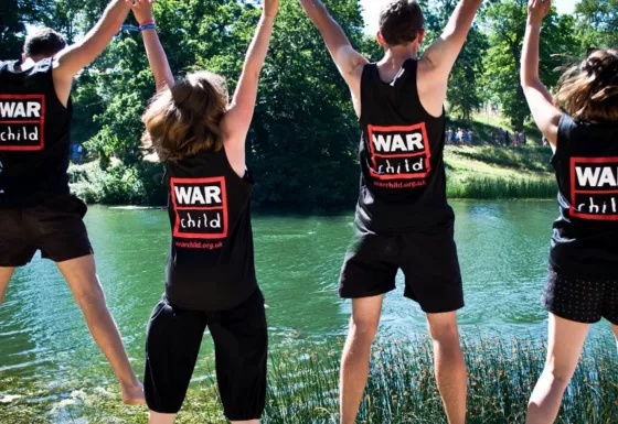 Team War Child supporters celebrate in their War Child tops