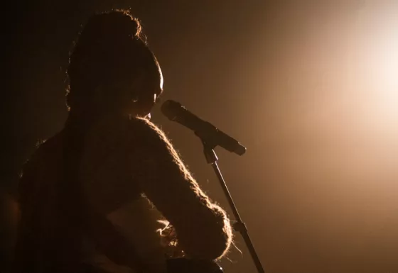 Girl singing on stage 