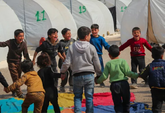 Children playing in a refugee camp in Syria. 