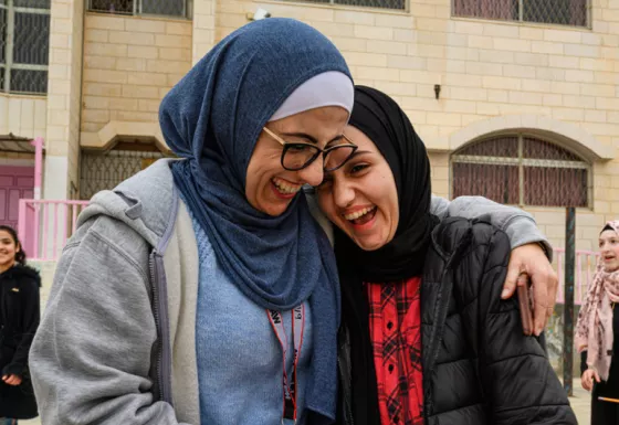 A War Child staff member and child in Palestine.