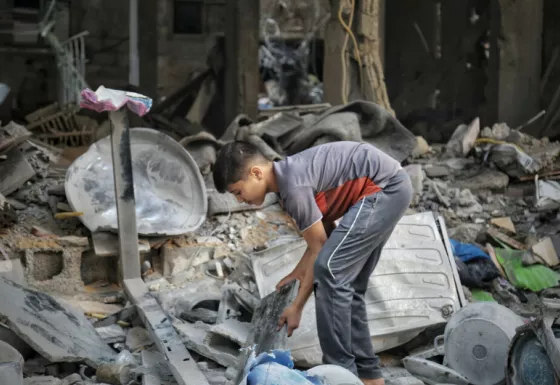 Child sorting through the rubble in Gaza.