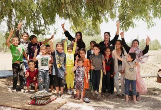A group of children and some War Child staff in Jordan.