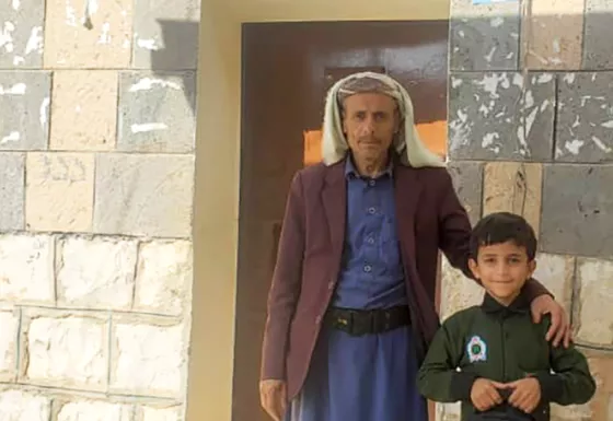 Salem and Saeed standing together.