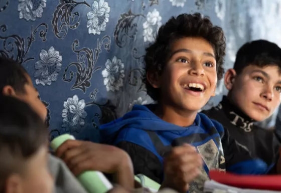 A child looking up and smiling