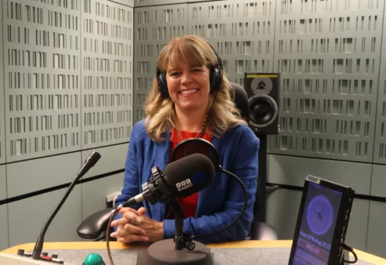 Claudia Hammond sitting in a radio studio.
