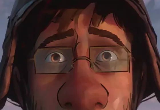 A close up of a mans face wearing glasses