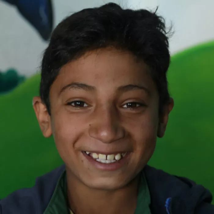 Jawad smiling in Afghanistan.