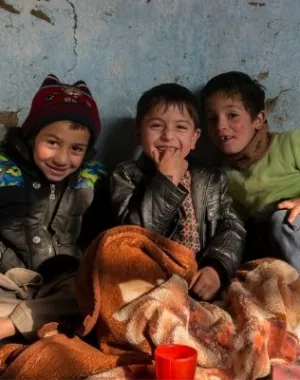 Children in Afghanistan smile at one of War Child's centres.