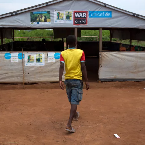 Former child soldier, Frederique walks into a War Child child-friendly space in the Central African Republic.